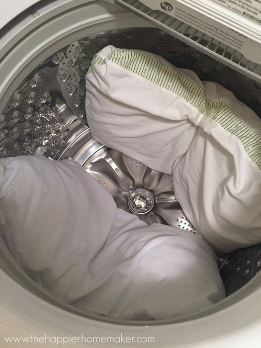 A blogger's two pillows placed in a washing machine.