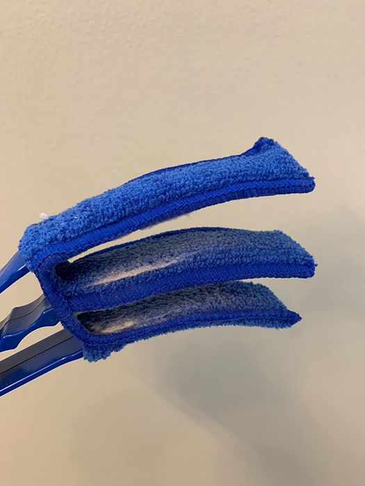 Reviewer photo of the duster brush with blue cloths