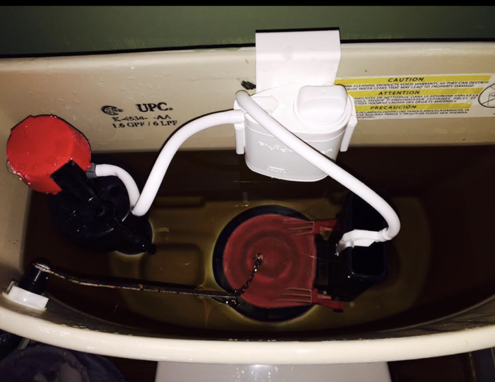 A reviewer's image showing the Flush 'n Sparkle Kit inside the water tank of their toilet