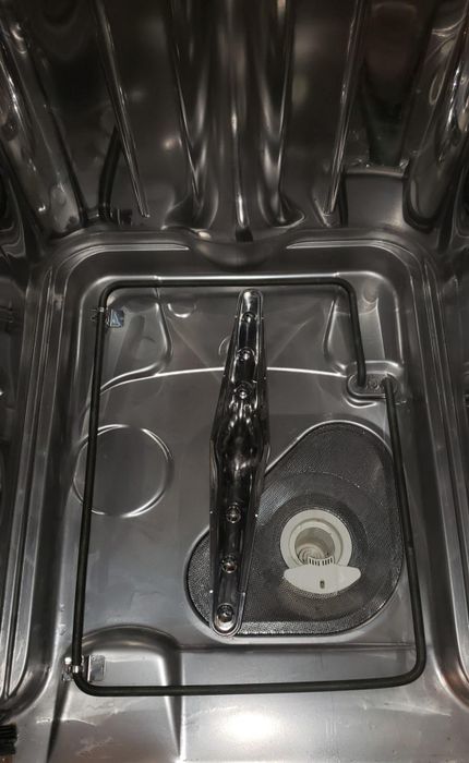 reviewer's after photo showcasing a noticeably cleaner and stain-free dishwasher
