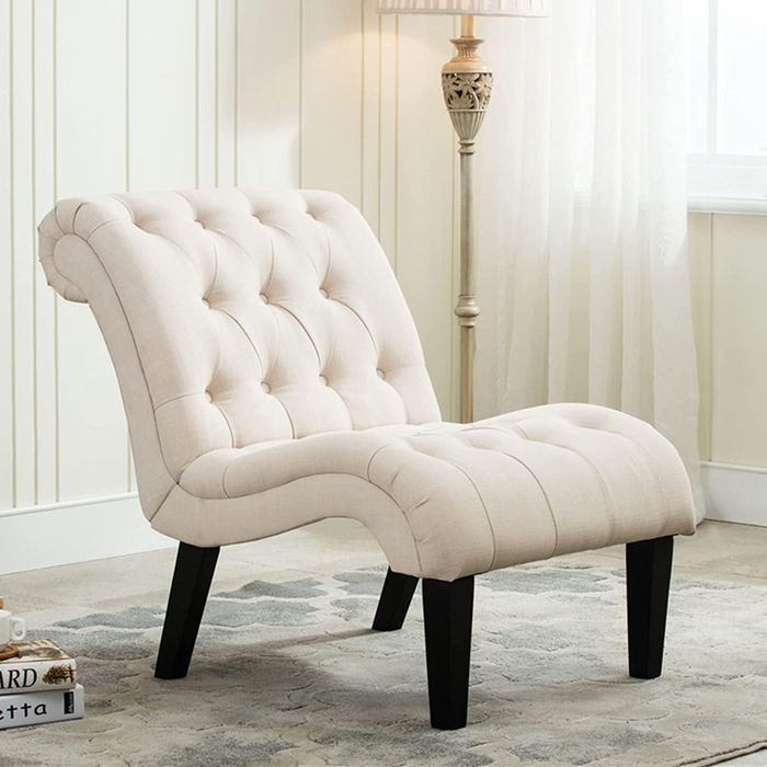 A lifestyle image featuring a curved white chair