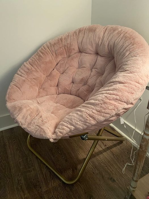 Reviewer image of the side view of a pink product in front of a white wall