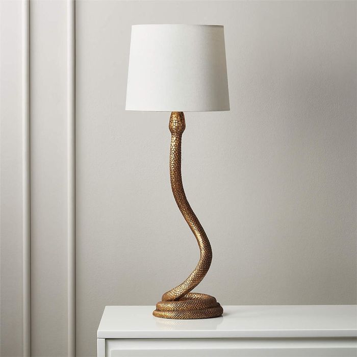 The front view of the snake-shaped lamp featuring a white light shade