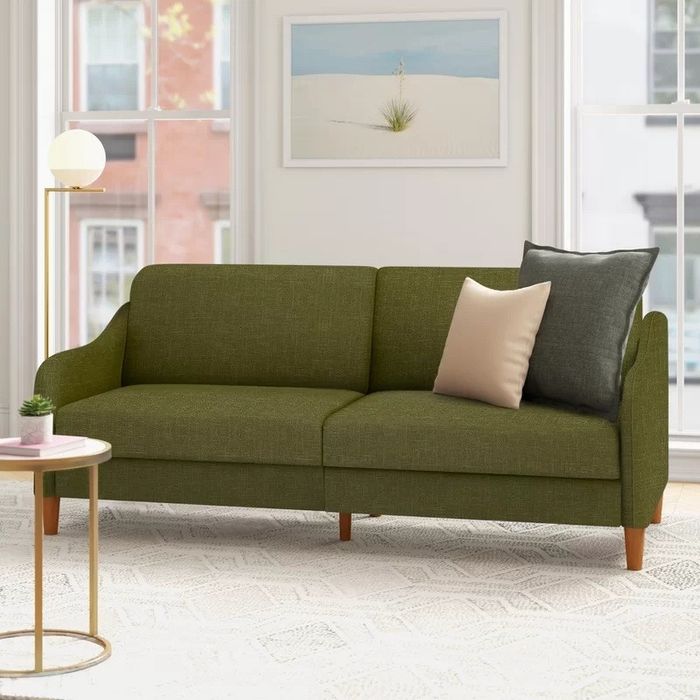 The olive green sofa.
