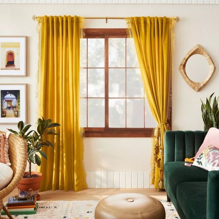 A room featuring soft yellow curtains that infuse the space with warmth and a cheerful vibe.