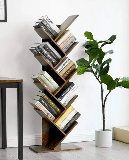 A vertical bookshelf with multiple angled pockets for books.