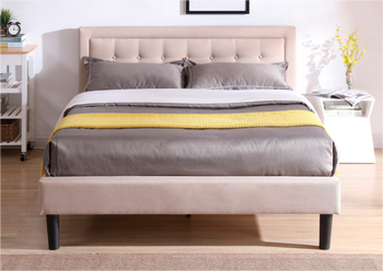 beige upholstered twin bed frame with a plush headboard