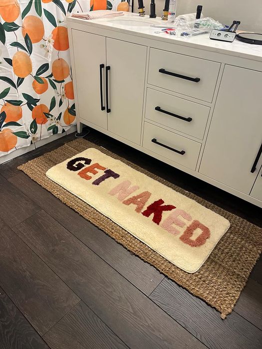 A quirky bath mat with a playful design.