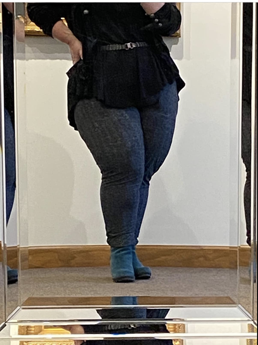 Reviewer styled in houndstooth-patterned joggers dressed up with work attire