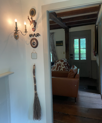 the broom elegantly hanging on my wall