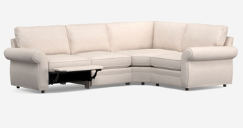 Lifestyle photo of a white rolled-arm sectional featuring a reclining footrest.