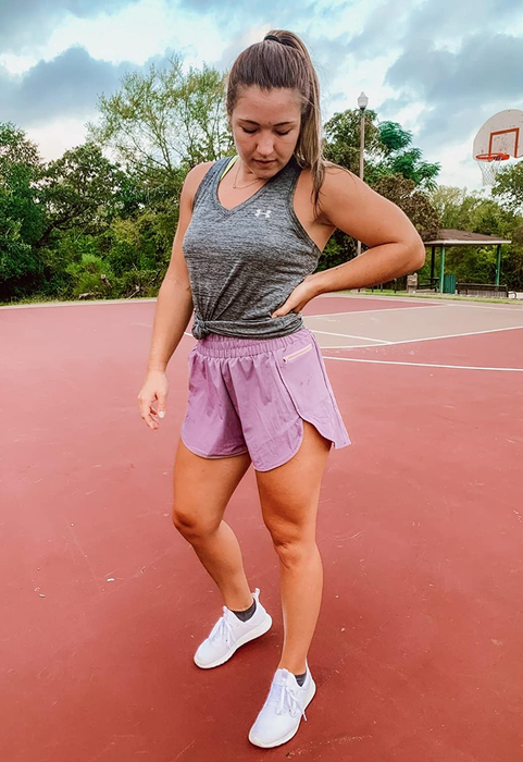 Another reviewer showing off pink shorts