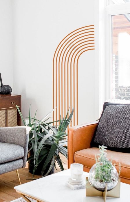 Orange arch wall decal displayed in a living room.