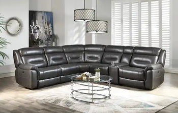 Lifestyle photo of a sleek black faux leather reclining sofa
