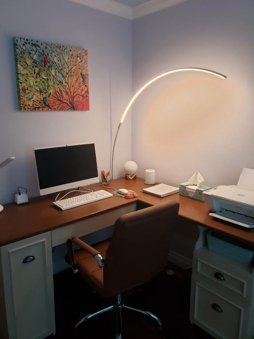 Another reviewer's lamp shining over a desk space