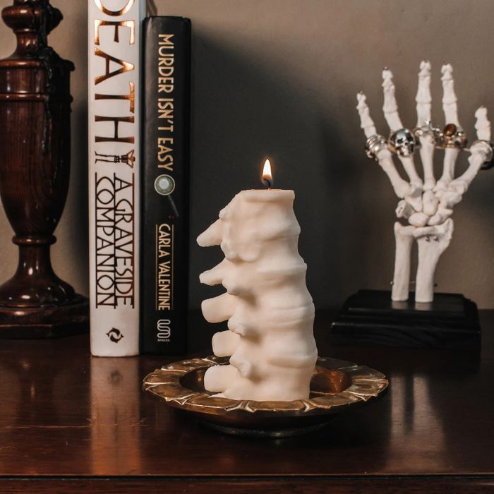 The candle, glowing in white