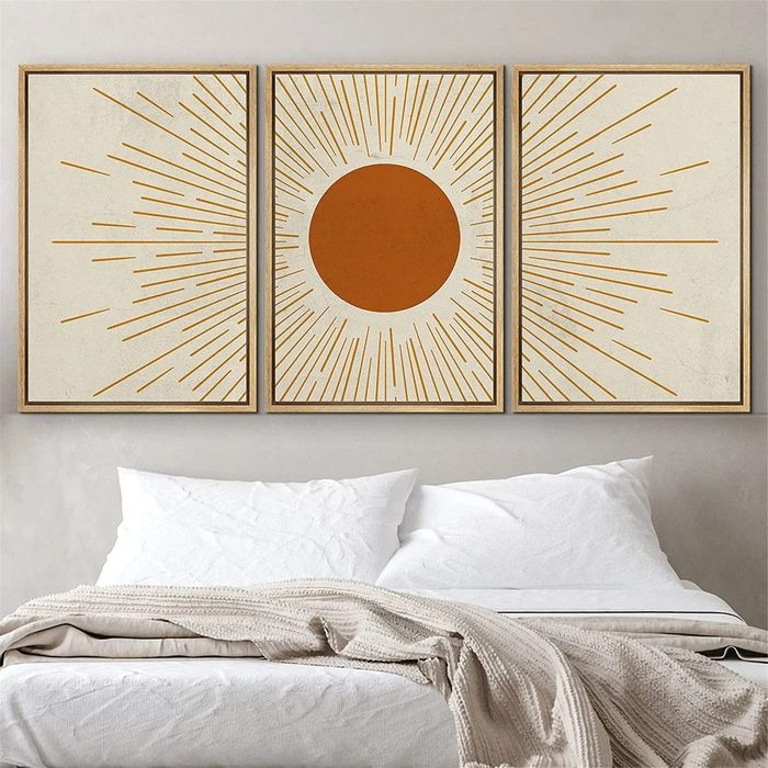 An orange and white sunburst art print.