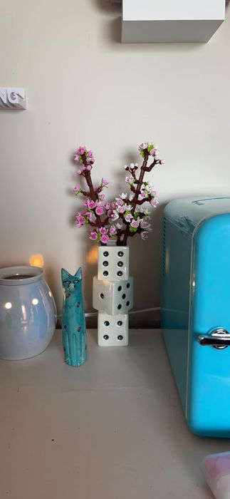 The vase holding Lego cherry blossom stems