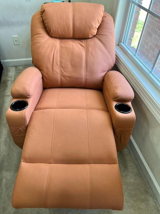 A reclined chair with the footrest fully extended for maximum comfort