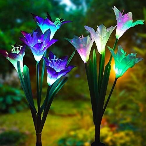 A collection of glowing light-up flowers shining brightly at night.