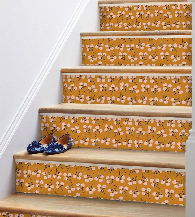 The wallpaper applied to stairs, adding a vibrant touch.