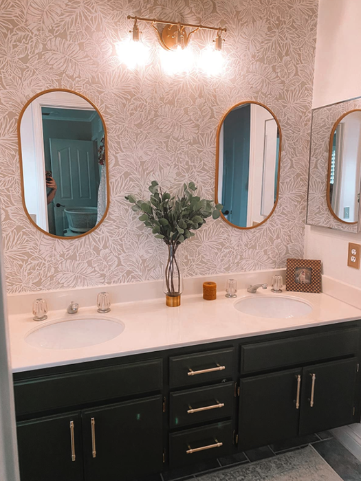 A different reviewer's bathroom featuring black cabinets with gold pulls installed on both drawers and cabinets