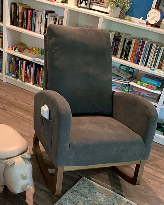 Reviewer image showing the product in black with wooden rocker legs and a convenient side pocket for storage