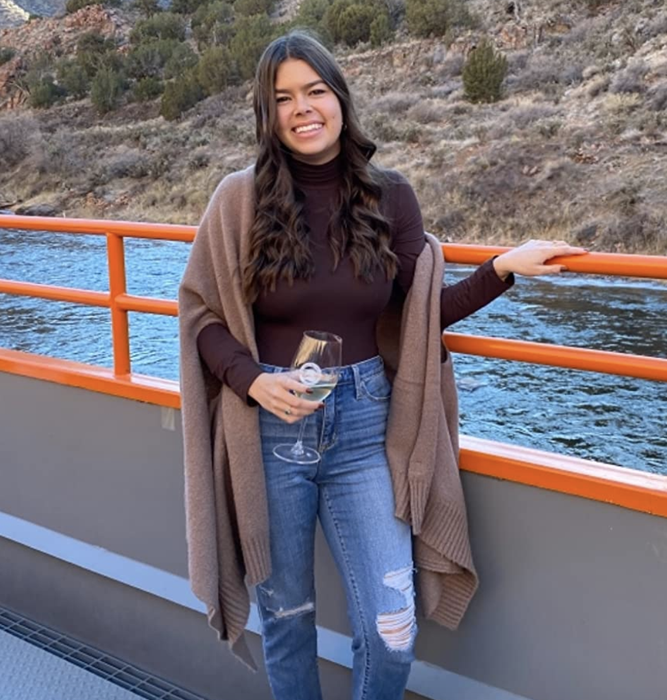 reviewer wearing a brown long-sleeved bodysuit