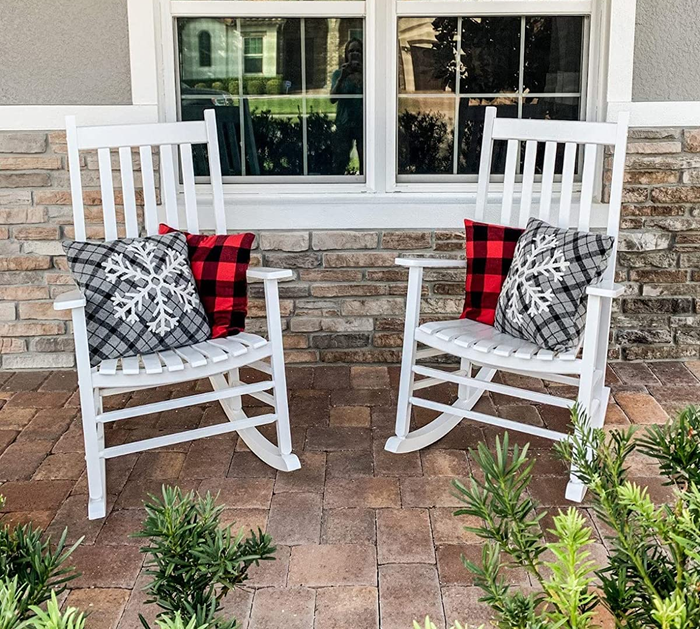Reviewer image showing two white rocking chairs with snowflake patterns and red and black gingham throw pillows