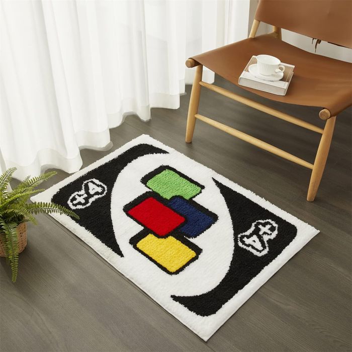 A rug featuring an Uno card design with a 'Plus Four' card prominently displayed.