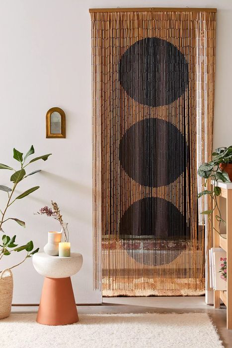 Brown beaded curtains with black dot patterns