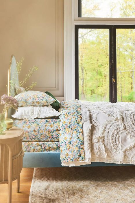 The blue floral sheet set styled in a bedroom