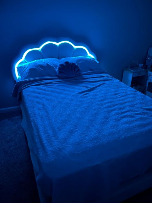 A reviewer’s photo showing the blue light turned on with the lights off.