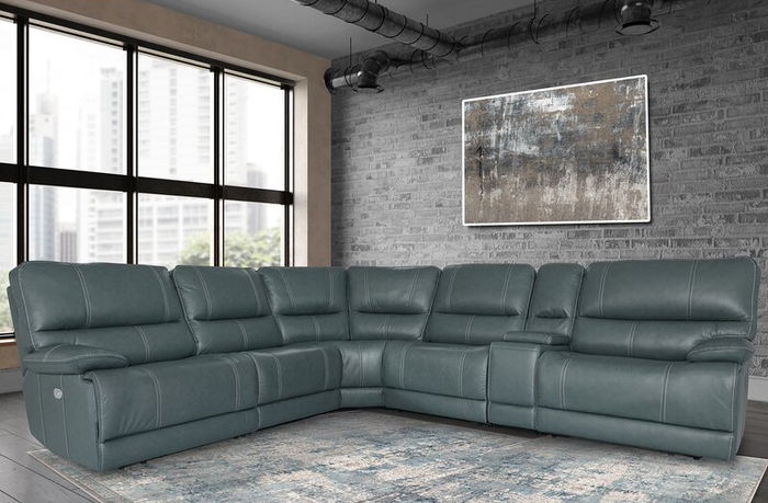 Lifestyle photo of a teal L-shaped reclining sectional sofa