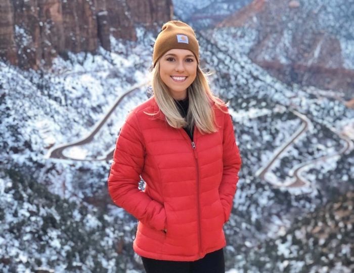 Reviewer wearing a red jacket.