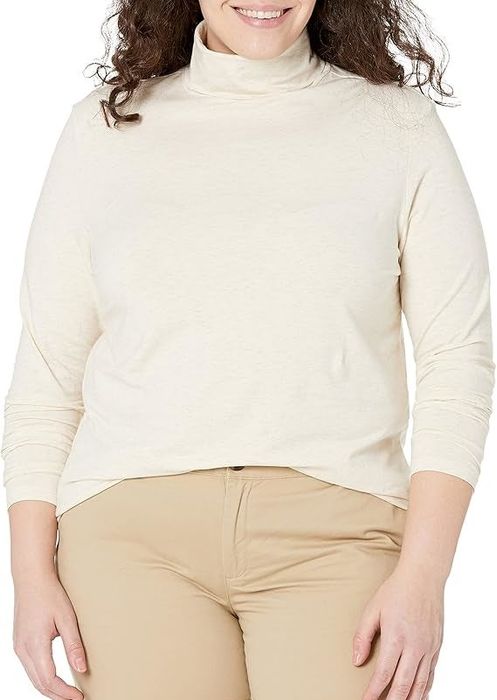 Person sporting the oatmeal heather turtleneck top