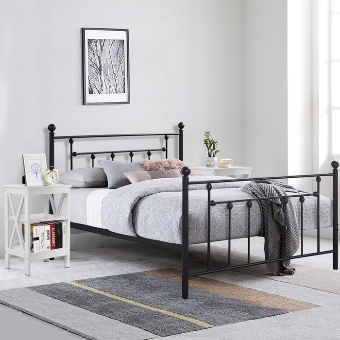 A black iron bed frame.