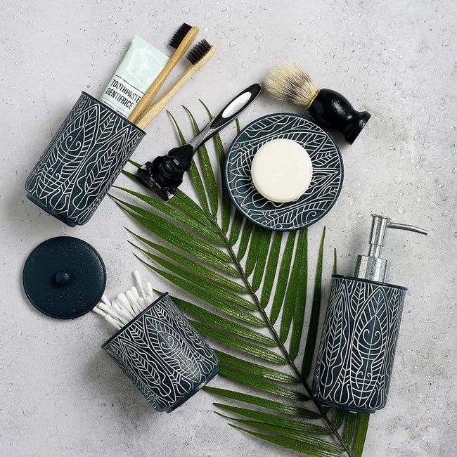 The Navy Blue Bathroom Accessory Set displayed on a surface.