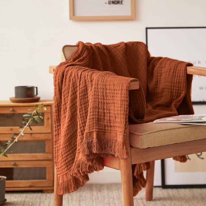 a blanket draped over a wooden chair