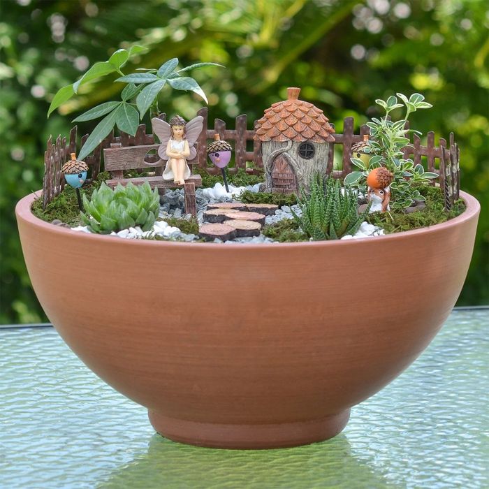 The fairy garden kit beautifully arranged inside a potted plant