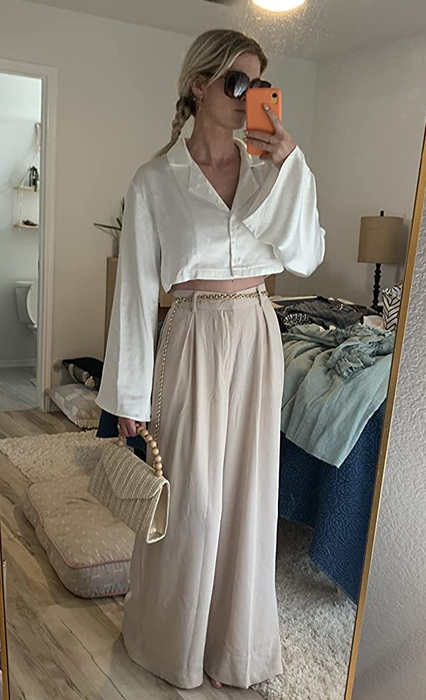 Reviewer wearing the beige trousers.