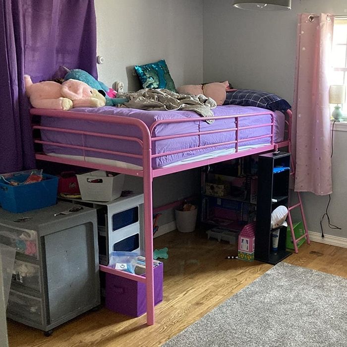 Reviewer image of a pink bed frame.