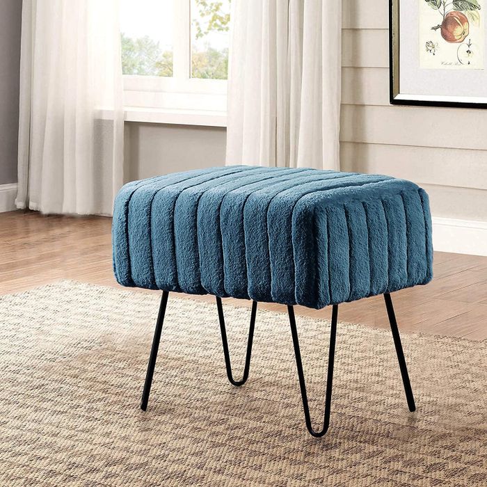 The ottoman in a vibrant teal shade