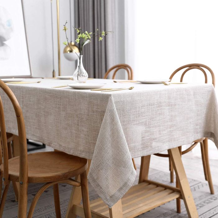 The same sophisticated tablecloth in a warm taupe shade, bringing a refined and timeless touch