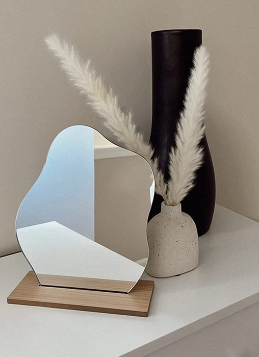 The mirror resting on a reviewer’s dresser.