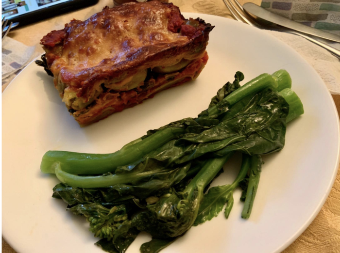 A single piece of lasagna served on a plate