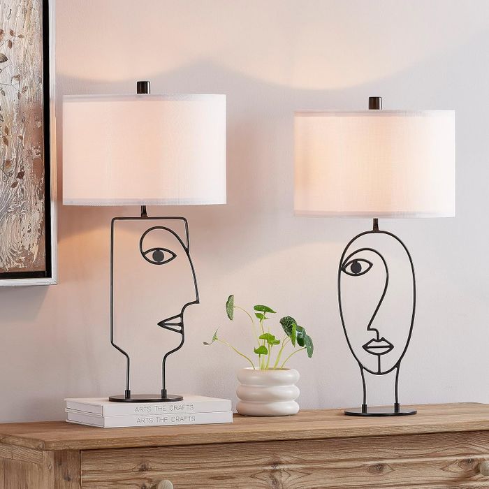 Two abstract table lamps with white lamp shades.