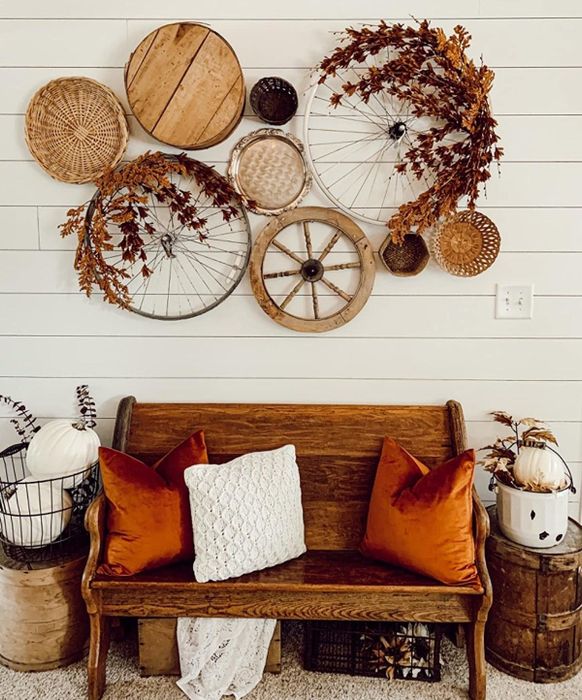 A reviewer’s photo of the cozy burnt orange pillows