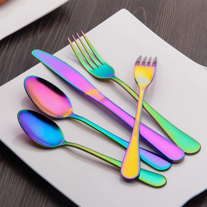 Rainbow-colored flatware elegantly arranged on a plate