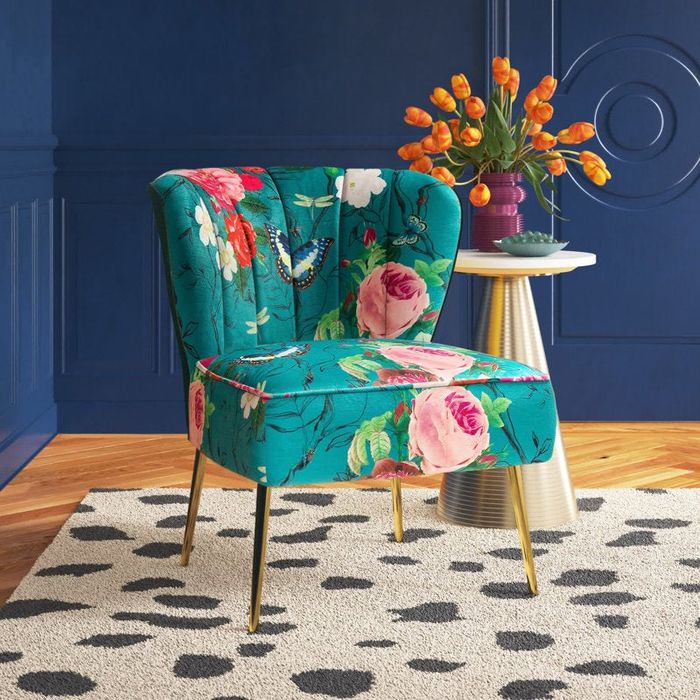 A blue floral patterned chair.